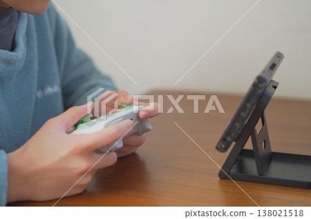 Image of a child playing a game Image of a child playing a game 138021518