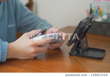 Image of a child playing a game Image of a child playing a game 138021519