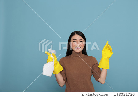 Asian happy glad housewife from daily work holding spray in yellow rubber glove, Cleaning home concept, Cheerful satisfied woman with positive mindset from day to day chores Asian happy glad housewife from daily work holding spray in yellow rubber glove, Cleaning home concept, Cheerful satisfied woman with positive mindset from day to day chores 138021726
