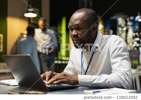 Office employee managing schedules on laptop, organizing calendar appointments and meetings at desk. Bookkeeper compiling computerized company information records on notebook 138022092