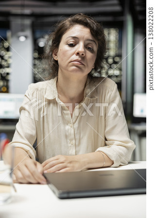 General manager in a dark office at midnight struggling to find motivation after intense workload, dealing with burnout due to work tension and mental haze. Career and workplace challenges. 138022208