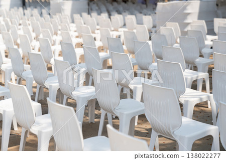 Large scale seating setup with many chairs prepared for an audience in a big event or conference environment. Large scale seating setup with many chairs prepared for an audience in a big event or conference environment. 138022277