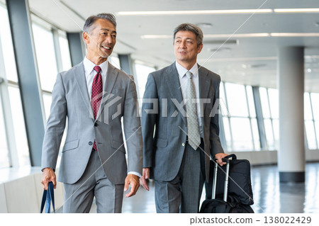 Senior businessman carrying a carry-on bag 138022429