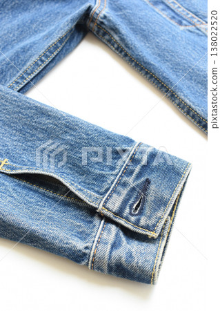 sleeve of blue denim shirt texture isolated on white background, jean fashion style 138022520