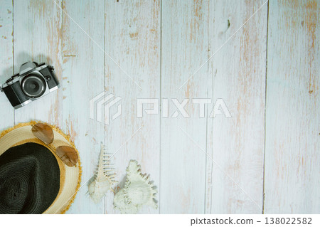 web banner and flat lay summer time with swimsuit and beach accessories on vintage blue wooden background 138022582