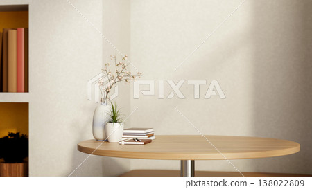 Books with vase and potted plants on round wooden table aside recessed shelf in living room. corner. 138022809