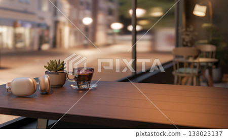 Headphones and coffee cup aside succulent on wooden table in dim lit cafe with city over glass wall. Headphones and coffee cup aside succulent on wooden table in dim lit cafe with city over glass wall. 138023137