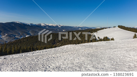 Snowy landscape with mountains and clear sky at sunny day Snowy landscape with mountains and clear sky at sunny day 138023691