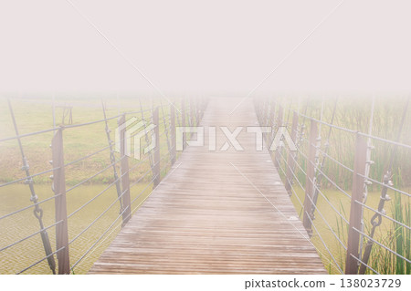 Foggy Wooden Bridge with Soft Pastel Atmosphere 138023729
