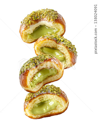Multiple pistachio glazed donuts with crushed nuts isolated on a white background, concept of sweet bakery treats 138024091
