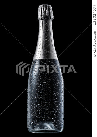 Champagne bottle with rising bubbles and silver foil on black backdrop with clipping path, symbolizing celebration and elegance 138024577