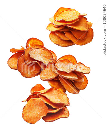 Piles of sweet potato chips placed randomly, isolated on white background, concept of healthy snack food 138024646