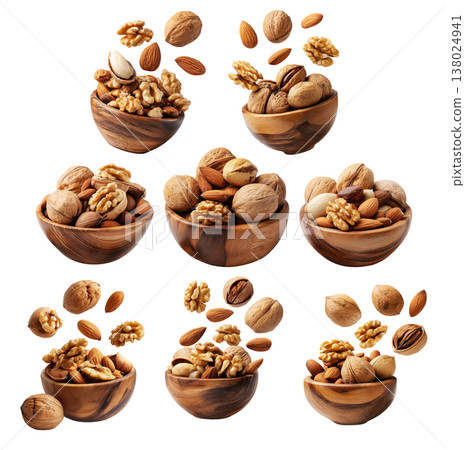 Whole and cracked walnuts with almonds and fresh green leaves, isolated on white transparent background, concept of healthy eating 138024941