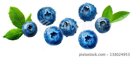 Close-up of ripe blueberries with water droplets and green leaves on white background, symbolizing freshness and healthy eating 138024953