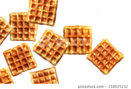 Multiple golden brown square waffles scattered randomly, isolated on white background. Concept of breakfast or snack food Multiple golden brown square waffles scattered randomly, isolated on white background. Concept of breakfast or snack food 138025232