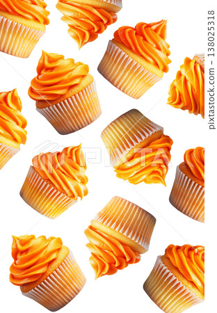 Multiple orange frosted cupcakes scattered in a seamless pattern isolated on a white background, concept of dessert variety 138025318