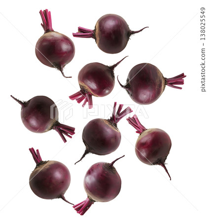 Whole red beetroots arranged in a scattered pattern, isolated on a white background, representing organic vegetables 138025549