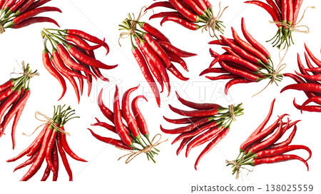 Bunches of red chili peppers with green leaves isolated on white background, concept of spice and flavor Bunches of red chili peppers with green leaves isolated on white background, concept of spice and flavor 138025559