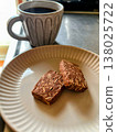 Almond chocolate cookies and coffee for a snack (vertical) 138025722