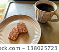 Almond chocolate cookies and coffee for a snack (side view) 138025723