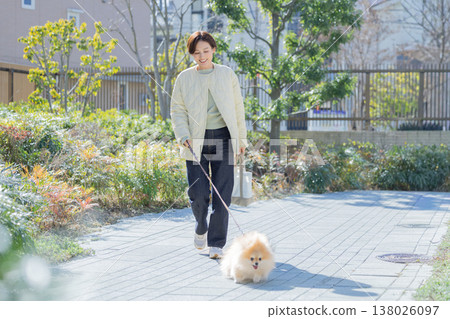 Lifestyle: A woman walking her dog 138026097