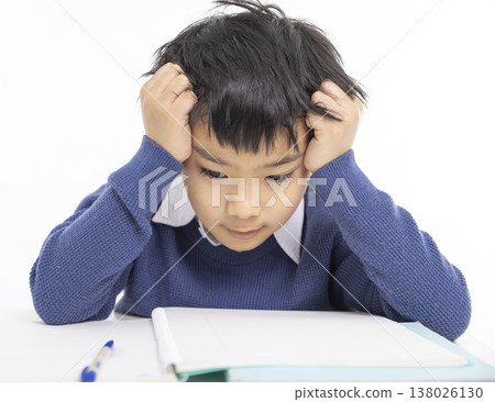 Frustrated  boy struggling with homework 138026130