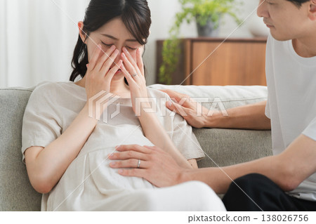 A husband supporting an emotionally unstable pregnant woman Lifestyle image A husband supporting an emotionally unstable pregnant woman Lifestyle image 138026756