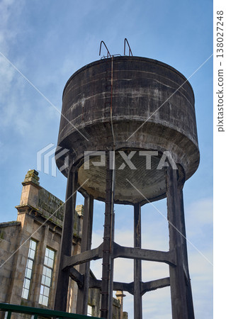 Detail of aged and abandoned industrial concrete architecture on a vacant lot in Vigo 138027248