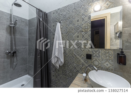 Modern Hostel Bathroom with Shower Stall and White Vessel Sink Modern Hostel Bathroom with Shower Stall and White Vessel Sink 138027514