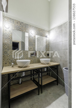 Vertical Shot of Modern Hostel Bathroom with Double Sinks Vertical Shot of Modern Hostel Bathroom with Double Sinks 138027533