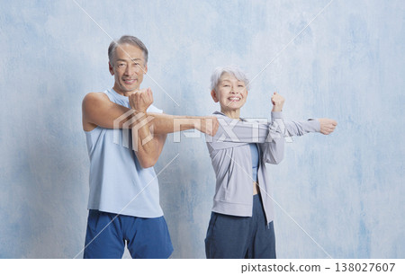 Senior couple exercise arm stretching Senior couple exercise arm stretching 138027607