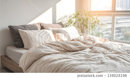 Cozy bedroom sunlight unmade bed cotton sheet soft pillow white wall morning light natural decor indoor plant minimalist style cozy bedroom with warm sunlight over unmade bed and cotton sheet Cozy bedroom sunlight unmade bed cotton sheet soft pillow white wall morning light natural decor indoor plant minimalist style cozy bedroom with warm sunlight over unmade bed and cotton sheet 138028196