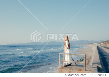 Portrait of a young woman gazing at the sea 138028461