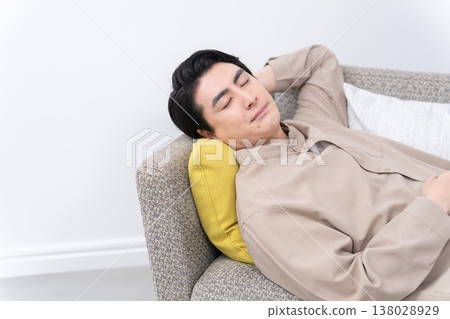 A man sleeping on the sofa A man sleeping on the sofa 138028929