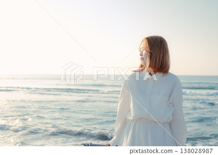 A woman whose eyes close at the beach A woman whose eyes close at the beach 138028987