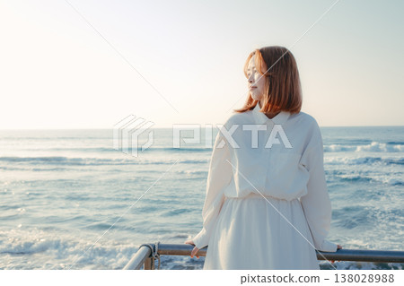 A woman whose eyes close at the beach A woman whose eyes close at the beach 138028988
