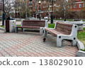 Empty Park Benches With Pigeon Near Trash Can in Urban Spring Plaza 138029010