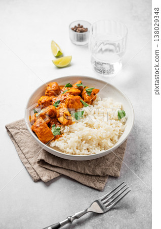 Chicken tikka masala curry with rice on marble background Chicken tikka masala curry with rice on marble background 138029348