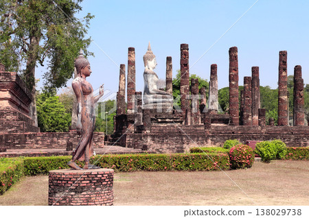 Ancient stone Buddha statue and ruins of ancient temple Wat Tra Phang So, Sukhothai historical park. Picturesque scene in Sukhothai old city, Northern Thailand. Topic of vacation, travel, trip, tour Ancient stone Buddha statue and ruins of ancient temple Wat Tra Phang So, Sukhothai historical park. Picturesque scene in Sukhothai old city, Northern Thailand. Topic of vacation, travel, trip, tour 138029738