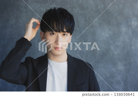 A young man smiling looking at the camera A young man smiling looking at the camera 138030641