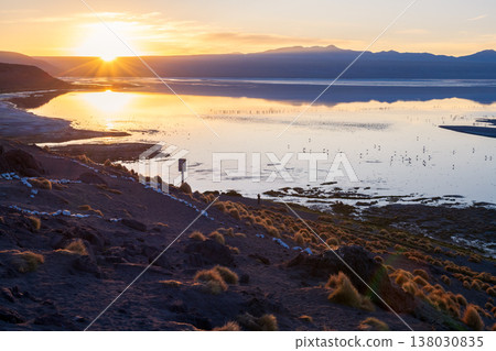 Peaceful sunrise landscape with nature, water, mountain, and lake reflection 138030835