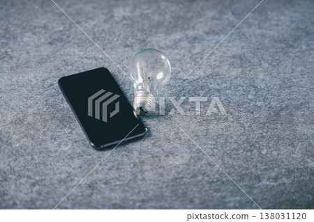 Light bulb for digital marketing business idea and innovation represents creative development, smart concept for market growth provides knowledge through mobile technology device Light bulb for digital marketing business idea and innovation represents creative development, smart concept for market growth provides knowledge through mobile technology device 138031120