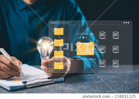 Light bulb business manager career project concept innovation strategy creative energy vision depicts digital document management, professional man handles virtual data storage Light bulb business manager career project concept innovation strategy creative energy vision depicts digital document management, professional man handles virtual data storage 138031125