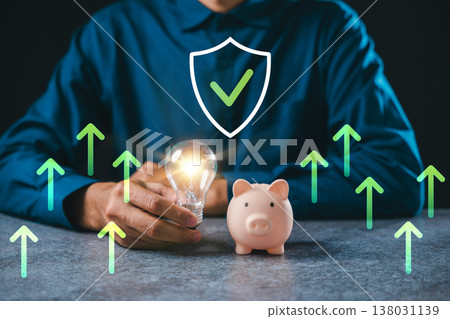 Innovation for financial business ideas shows hand holding glowing lightbulb near piggy bank, representing creative financial innovation concept for wealth growth and research Innovation for financial business ideas shows hand holding glowing lightbulb near piggy bank, representing creative financial innovation concept for wealth growth and research 138031139
