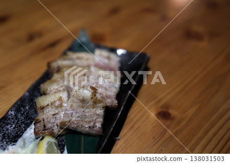 Grilled pork belly. A juicy dish. Close-up. 138031503