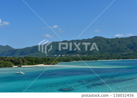 A ship floating in Kabira Bay and the blue sea A ship floating in Kabira Bay and the blue sea 138032456