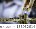 Save money concept with hand placing coin on stacked coins showing financial growth and investment 138032614