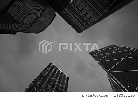 Skyscrapers in Hong Kong financial district, modern office towers architecture in black and white Skyscrapers in Hong Kong financial district, modern office towers architecture in black and white 138033130