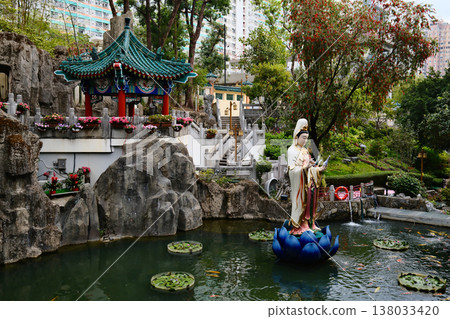 Buddha statue in the gardens of the Wong Tai Sin Temple, Hong Kong Buddha statue in the gardens of the Wong Tai Sin Temple, Hong Kong 138033420