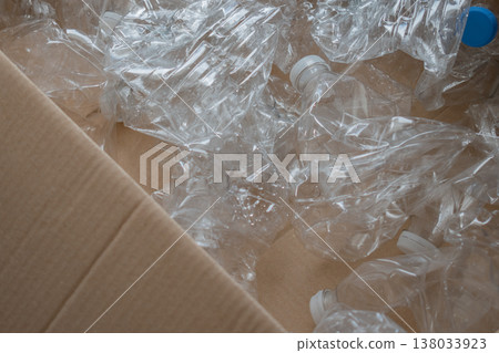 plastic recycling stream: pet bottles gathered as valuable secondary raw material in box plastic recycling stream: pet bottles gathered as valuable secondary raw material in box 138033923